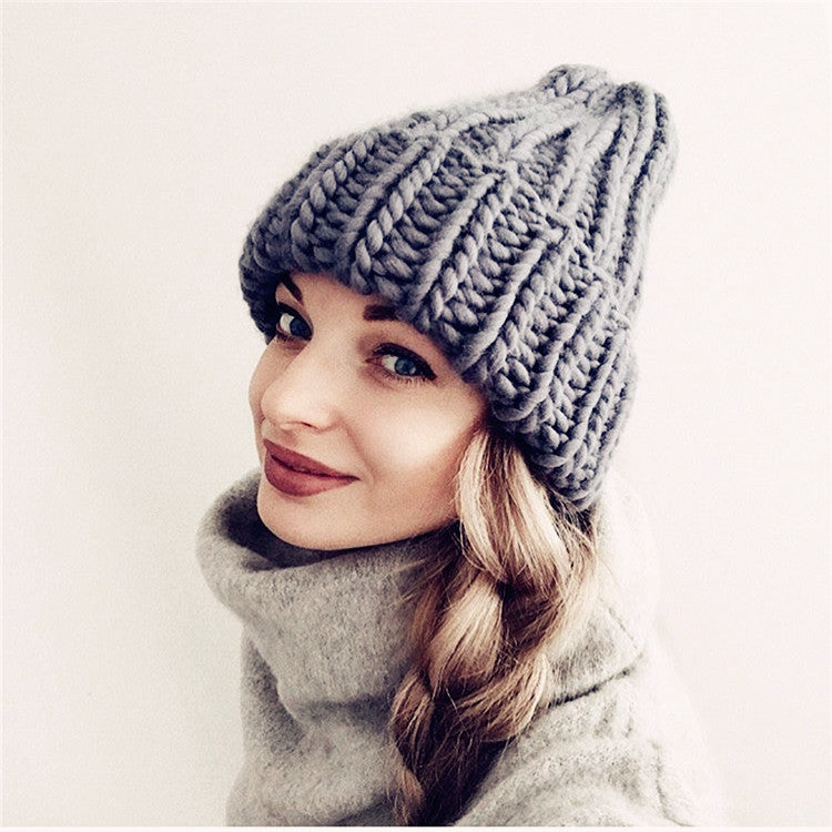 Europe and the United States new knit hat ladies autumn and winter fashion wild thick wool hat solid color simple earmuffs Limorista